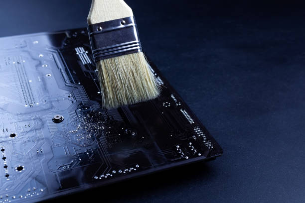 istock Cleaning the PC cleaning the motherboard from dust using a brush 1288451334