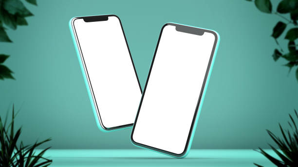 istock 3D rendering of Two iPhones mockup on a green background with plants. White screen 1288451926