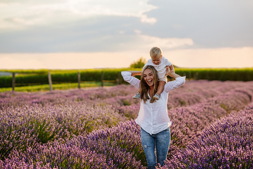 Mother and her son bonding together outdoors at the lavender field