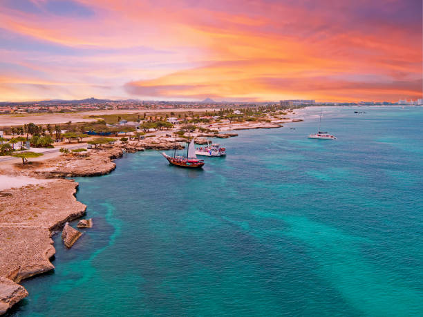 Aerial from Aruba island with Palm Beach in the Caribbean Sea at sunset Aerial from Aruba island with Palm Beach in the Caribbean Sea at sunset leeward dutch antilles stock pictures, royalty-free photos & images