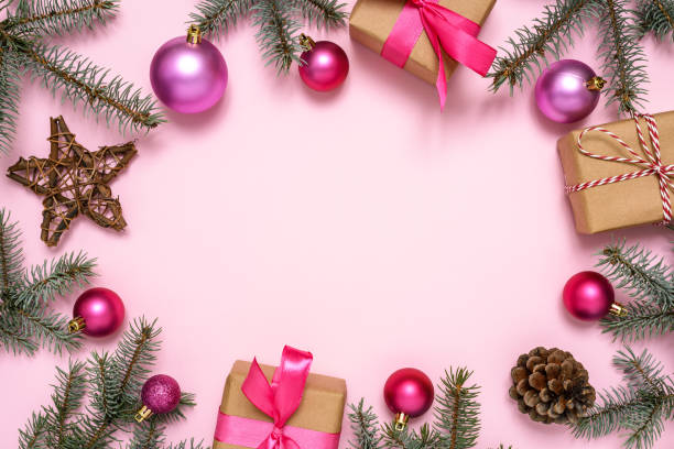 istock Christmas decorations and fir tree on pink background 1288454220