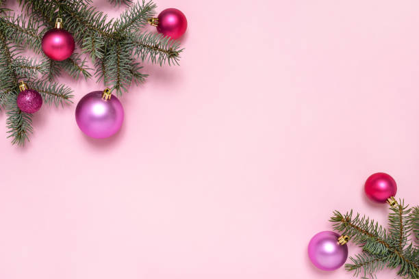 istock Christmas decorations and fir tree on pink background 1288454223