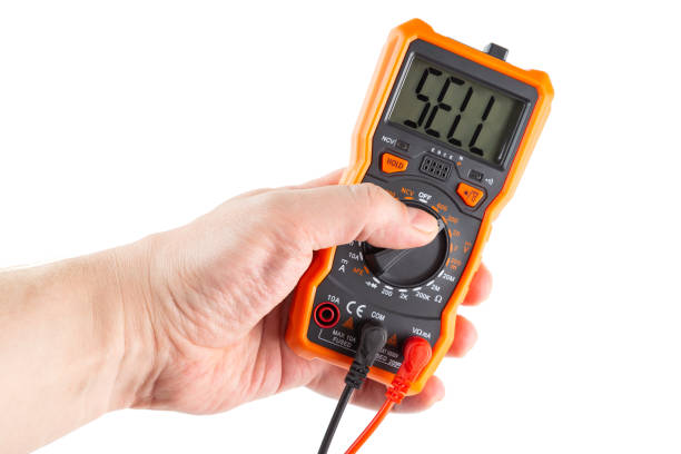 istock the word sell on screen of digital electrical multimeter in left hand, isolated on white 1288454479