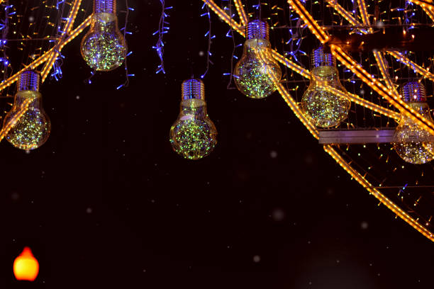 istock HOLIDAY CHRISTMAS LIGHTS IN BULBS ON A DARK BACKGROUND 1288454782