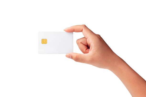 Closeup of female hand holding plastic credit card, blank white credit chip card isolated on white background.Template of blank credit card for your design, File with clipping path so easy to work. stock photo