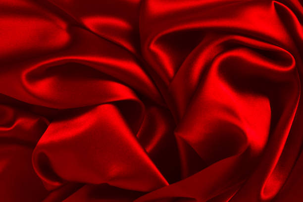 istock Red silk or satin luxury fabric texture can use as abstract background. Top view. 1288457539