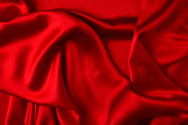 istock Red silk or satin luxury fabric texture can use as abstract background. Top view 1288457544