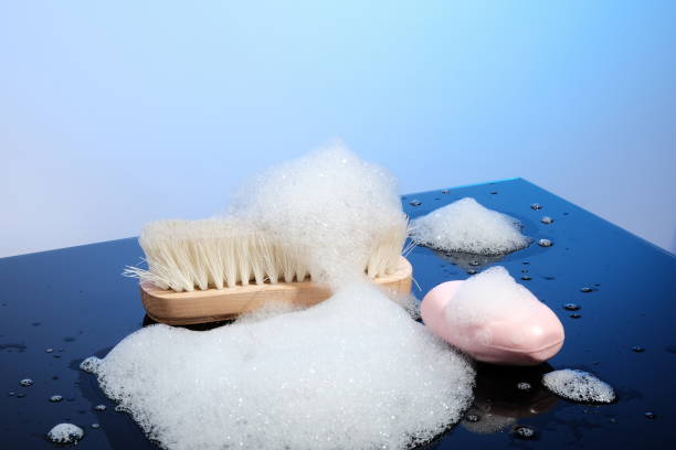 istock Clothes brush, soap and foam 1288460876