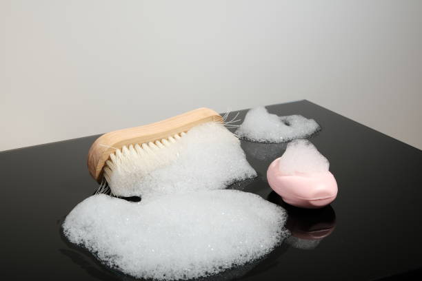 istock Clothes brush, soap and foam 1288462293