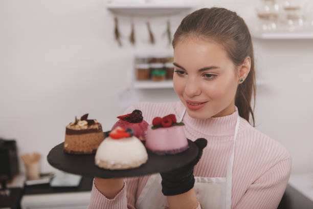 istock Female confectioner working at her cafe 1288464911