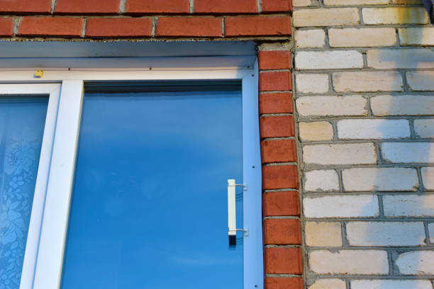 istock Plastic Euro window in a red and white brick house 1288466141