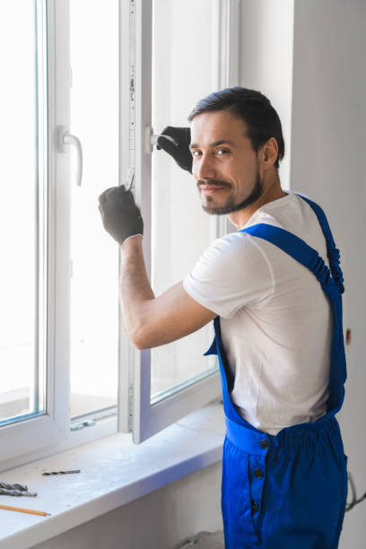 istock Builder installs the window and looks at the camera 1288466361