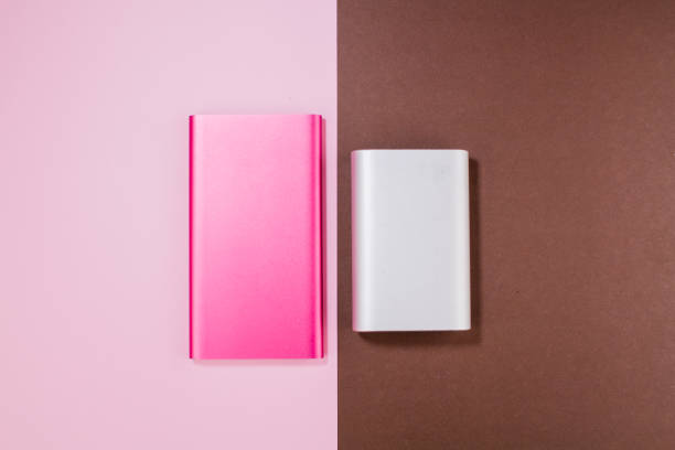 istock pink and gray power bank on background 1288468109