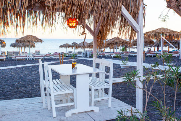 istock Street cafe on the Perissa beach, Greece 1288468203