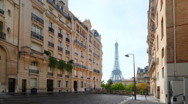 istock eiffel tour and Paris street 1288470073