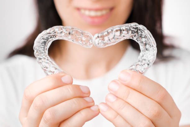 Making heart from aligners or removable braces. Making heart from aligners or removable braces dental aligner photos stock pictures, royalty-free photos & images