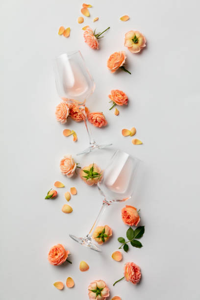 istock Rose wine and roses on white background 1288471659