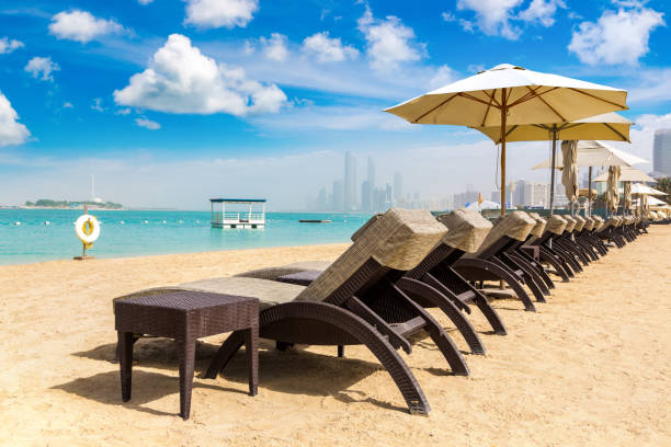 istock Sunbeds at the beach in Abu Dhabi 1288474297