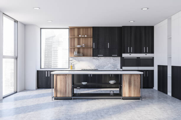 istock White and black kitchen interior with cabinets and island 1288475327