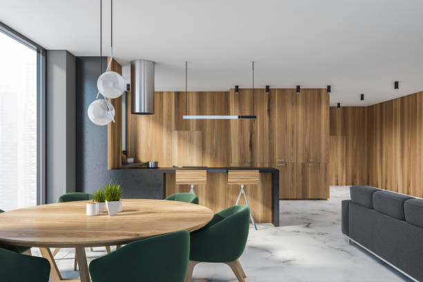istock Gray and wooden dining room interior 1288475737