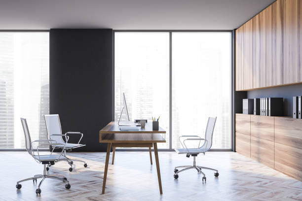 istock Modern gray CEO office with wooden cabinets, side view 1288475807
