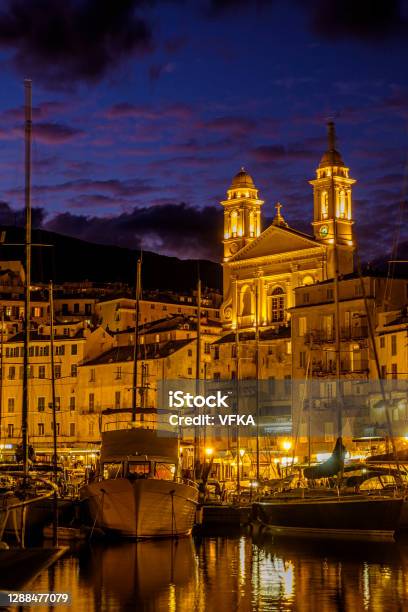 Church Saintjean Baptiste At The Old Harbor Of Bastia Corsica France After Sunset Stock Photo - Download Image Now