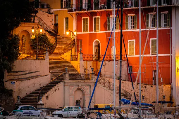 Magnificent staircase leading to Jardin de Romieu at the old harbor (Vieux-Port) of Bastia, Corsica, France after sunset.