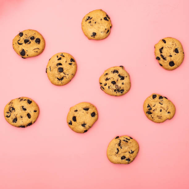istock Cookies with chocolate on a pink background. Sweet background. 1288477862