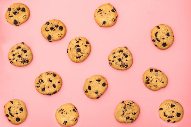 istock Cookies with chocolate on a pink background. Sweet background. 1288477870