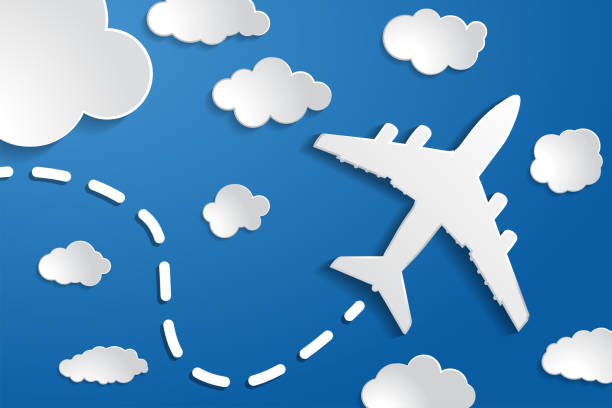istock paper airplane with clouds on a blue air background.  Blue sky t 1288479516