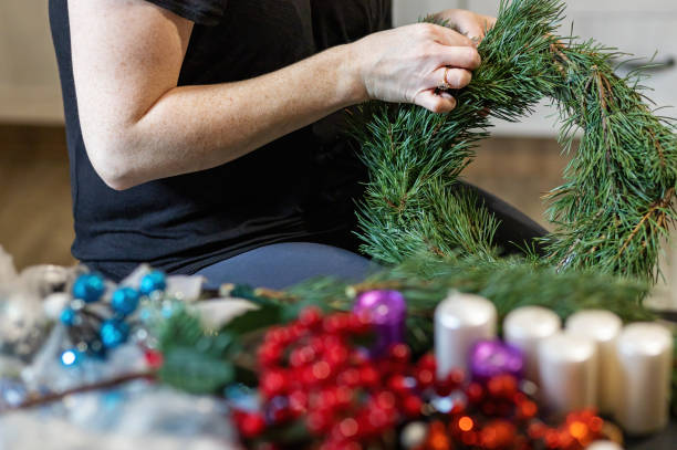 istock Handmade preparation of advent wreath close up. 1288480276