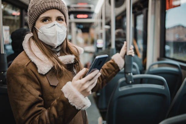 istock A woman with a face mask on public transportation 1288484457
