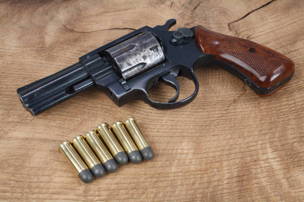 istock Revolver gun with ammunition 1288486292