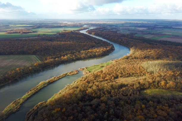 istock Yellow autumn forest and blue river, top view, autumn landscape 1288489268