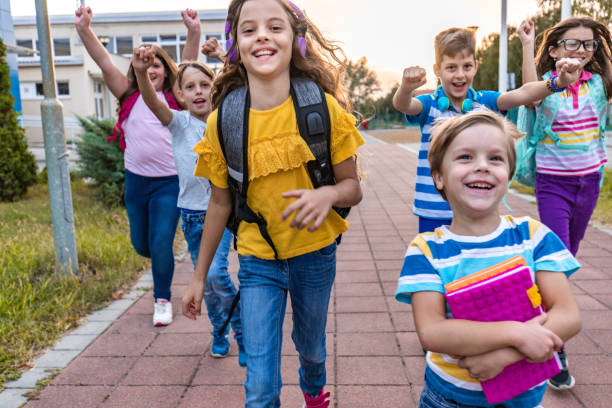 istock School kids running in schoolyard 1288490211