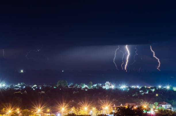 istock Thunderstorm with lightning and thunder over the night city 1288490559
