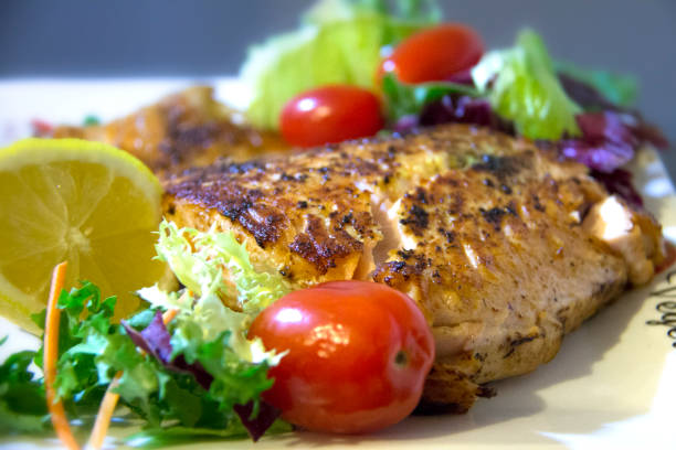istock Ready to eat salmon with vegetables. 1288491048