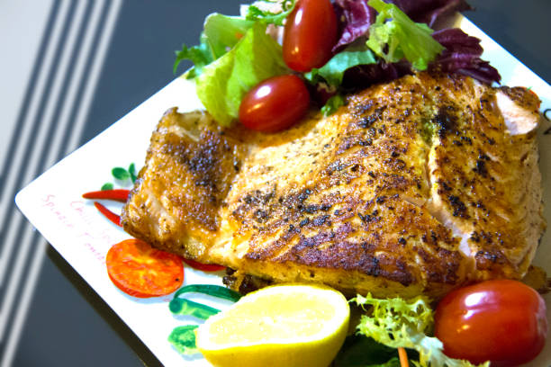 istock Ready to eat salmon with vegetables. 1288491170