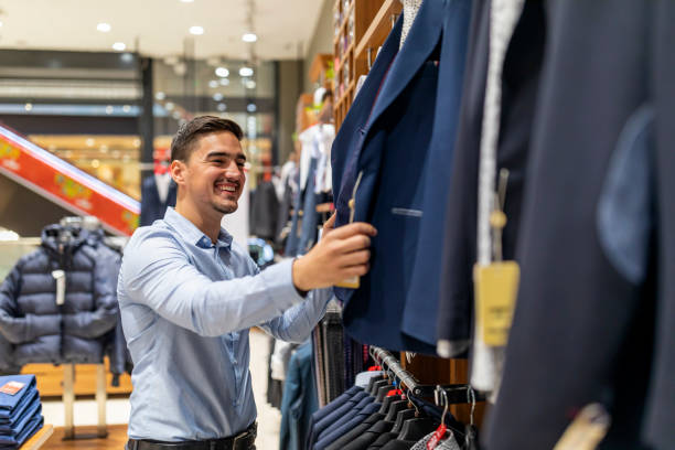 istock Man buying formal clothes at a store 1288494133