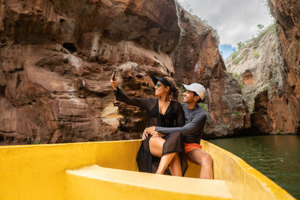 istock Embraced couple taking the selfie on the river boat ride 1288495003