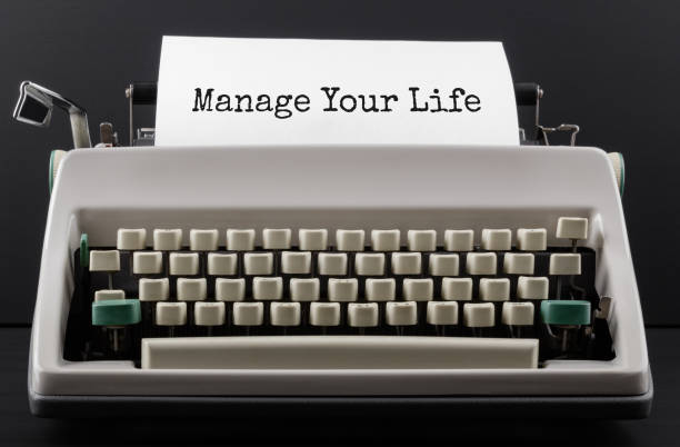 istock Text MANAGE YOUR LIFE typed on typewriter, close up. 1288495105