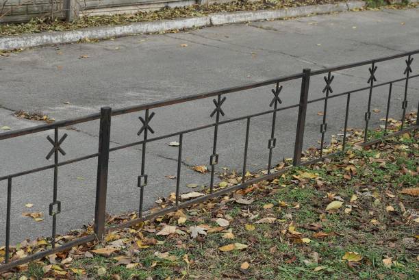 istock part of a black decorative fence with a wrought iron pattern 1288499894
