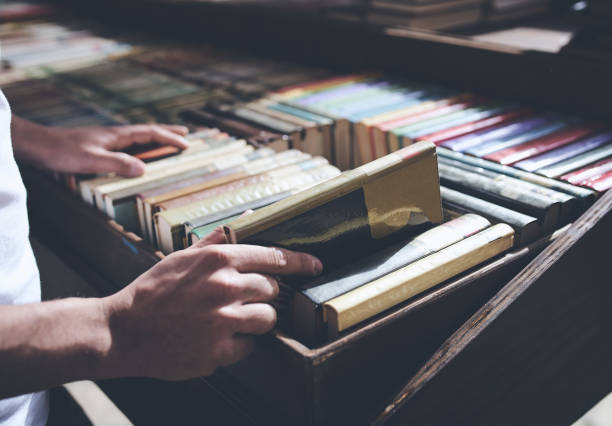 istock Male hand close up taking out a book 1288500419