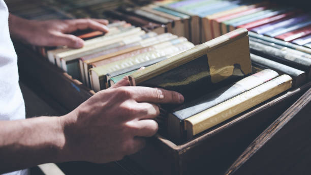 istock Male hand close up taking out a book 1288500426