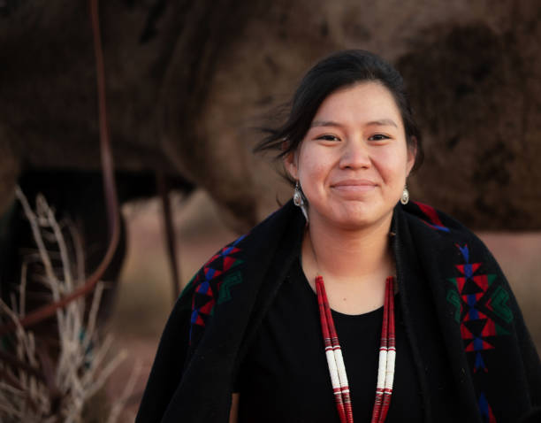 cheerful navajo young woman wearing traditional jewerly - first nations imagens e fotografias de stock