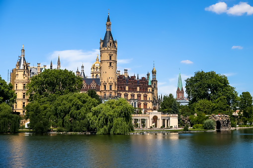 Exterior of Schwerin Castle in Germany against a clear blue sky