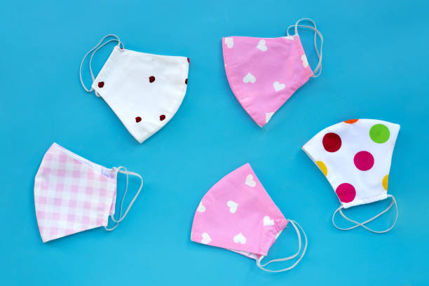 istock Handmade colorful cloth masks on blue background. 1288506001