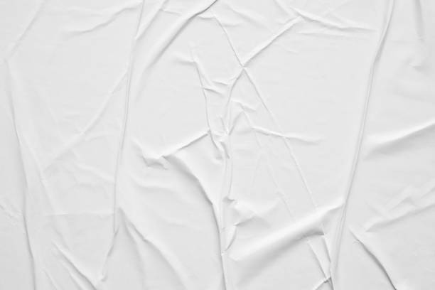 istock Blank white crumpled and creased paper poster texture background 1288510049