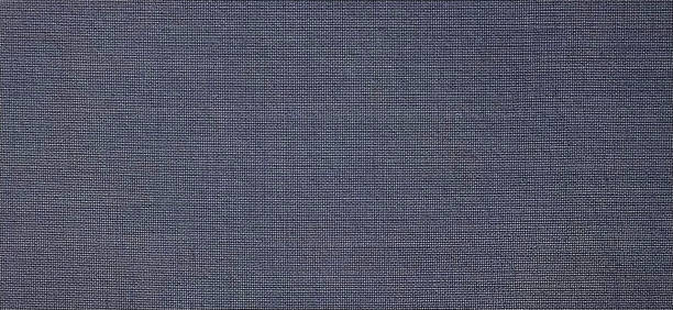 istock blue-violet background of intertwined threads, stripes and rows. Banner. Fabric texture with uneven surface 1288511168