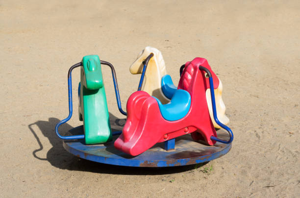 istock Horses shape carousel for children in playground. 1288511241